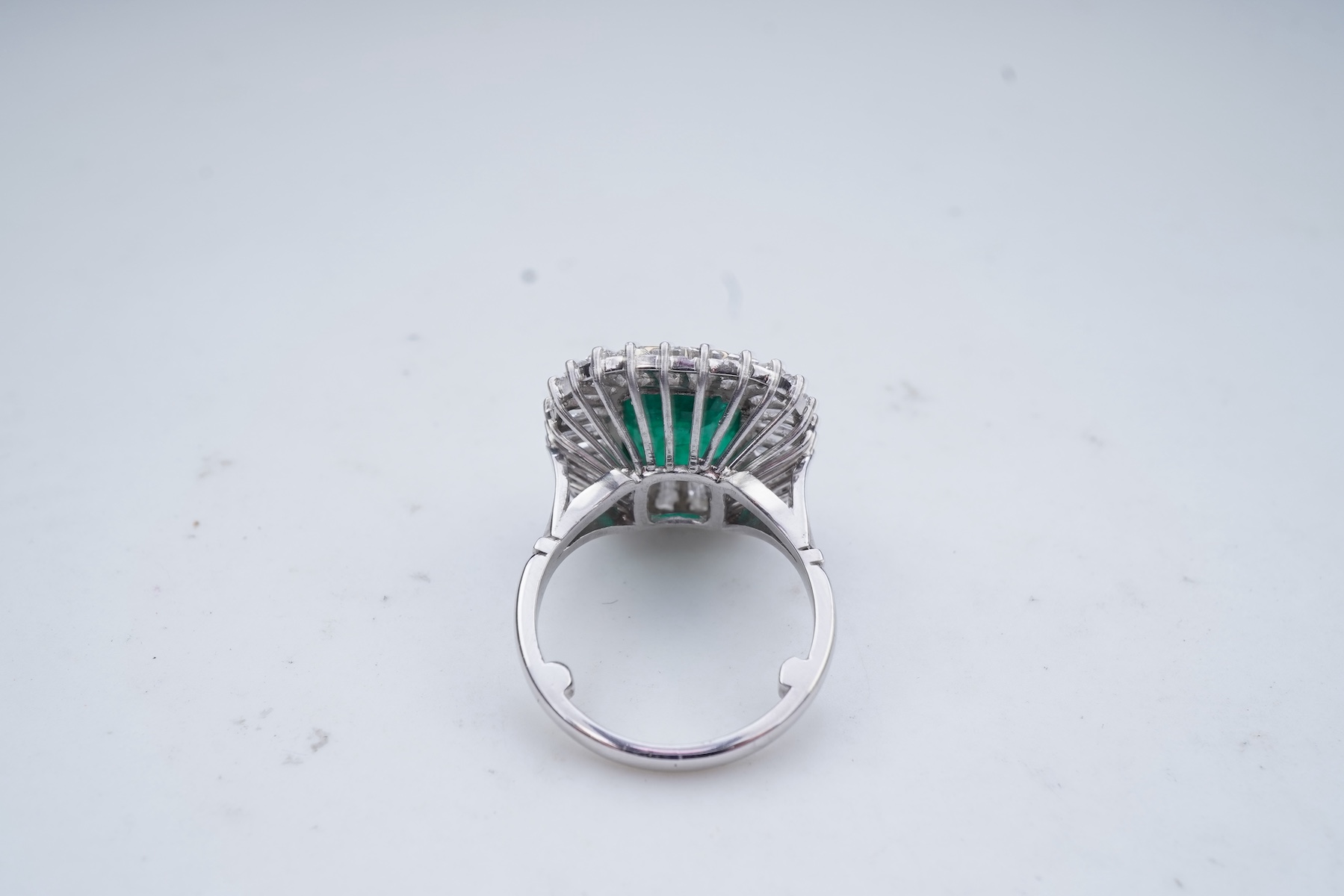 An emerald and diamond ring
